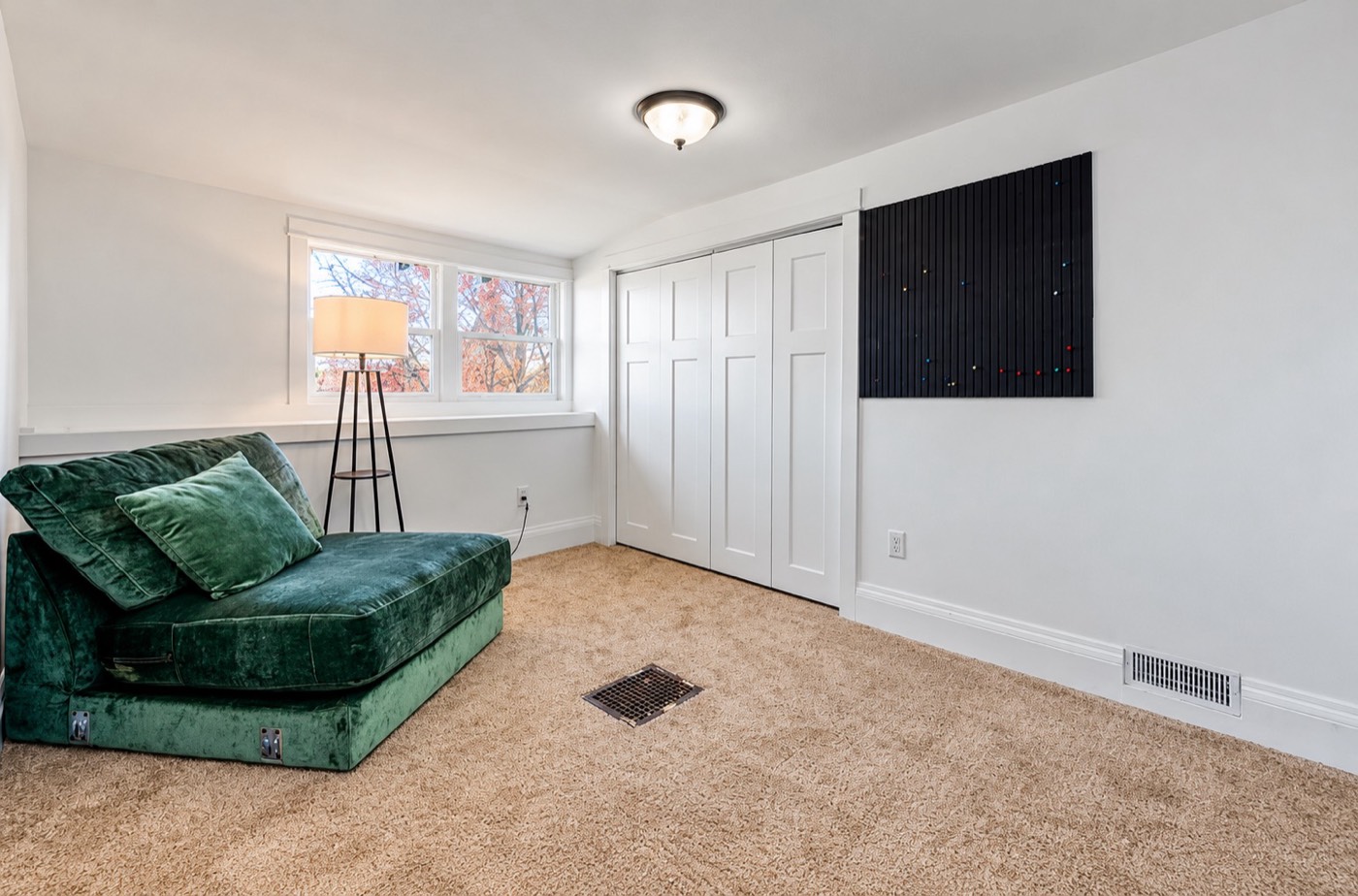Bedroom with white closet doors, fresh paint and trim