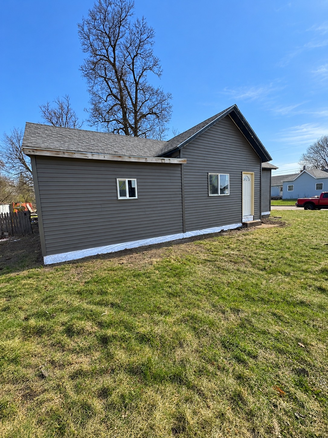 Single-story home with new gray lap siding